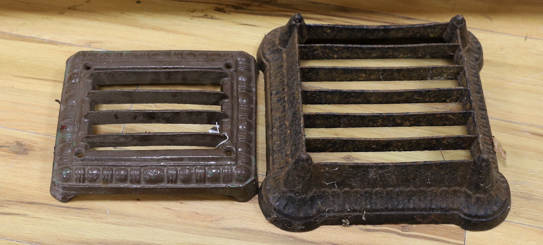 Two cast iron grille boot scrapers